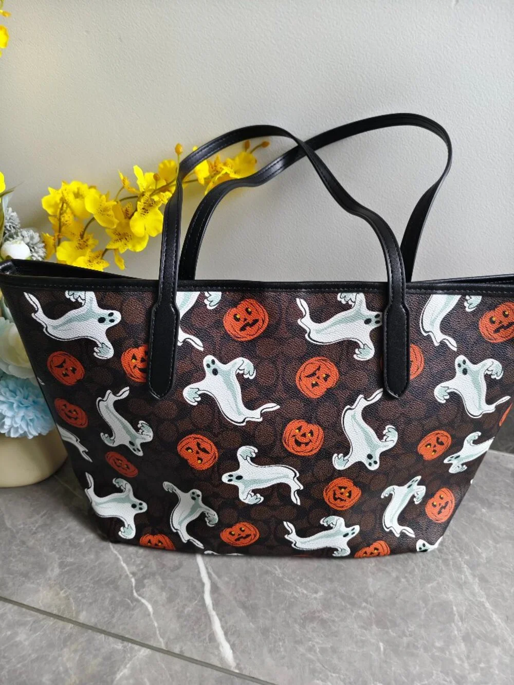 Coach tote featuring